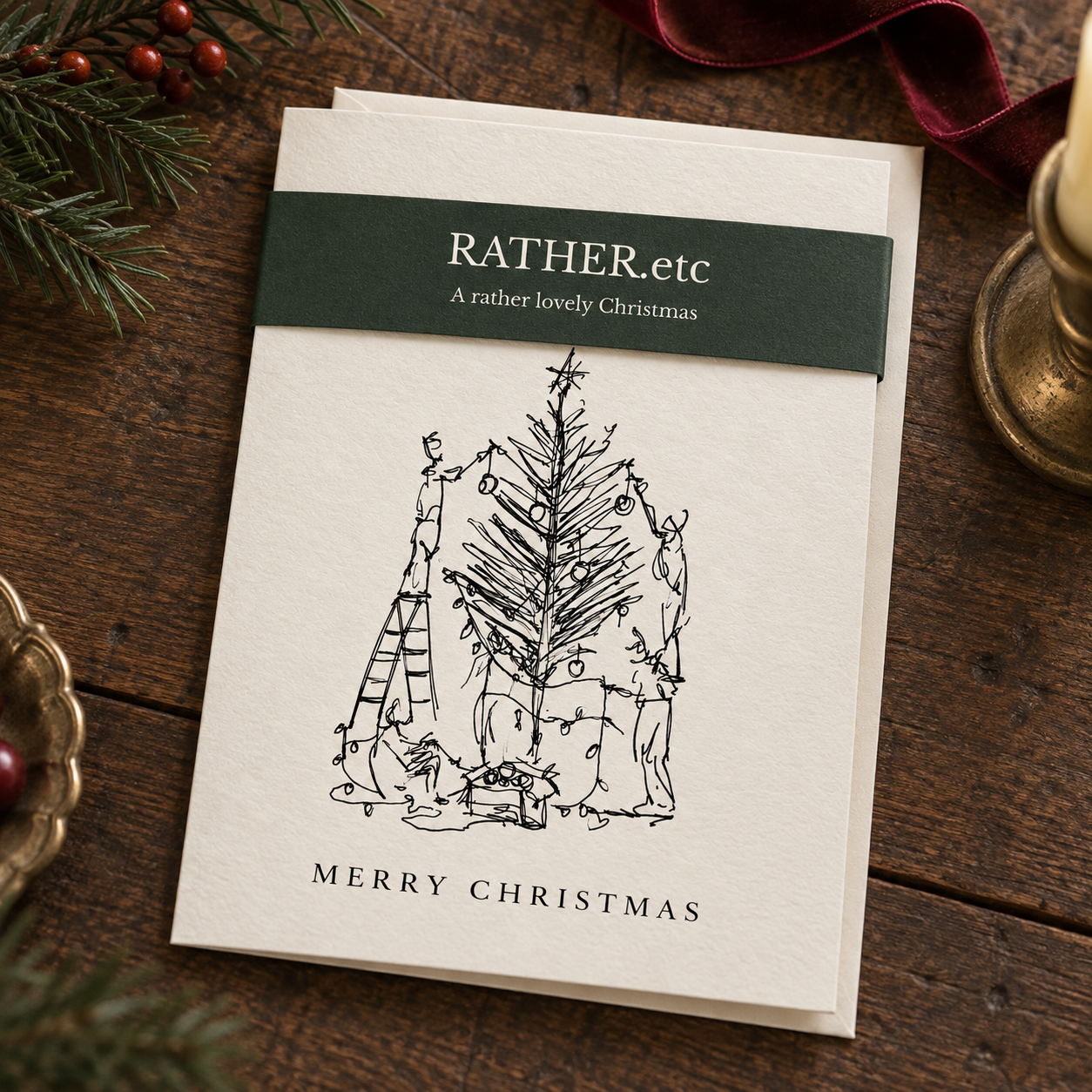 RATHER.etc Christmas card with a forest-green belly band